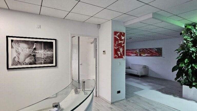 photo of a waiting room with a picture of fine art photograph hanging on the wall