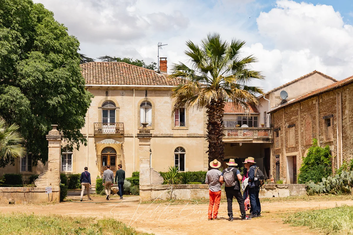 a group of people walking in front of a building