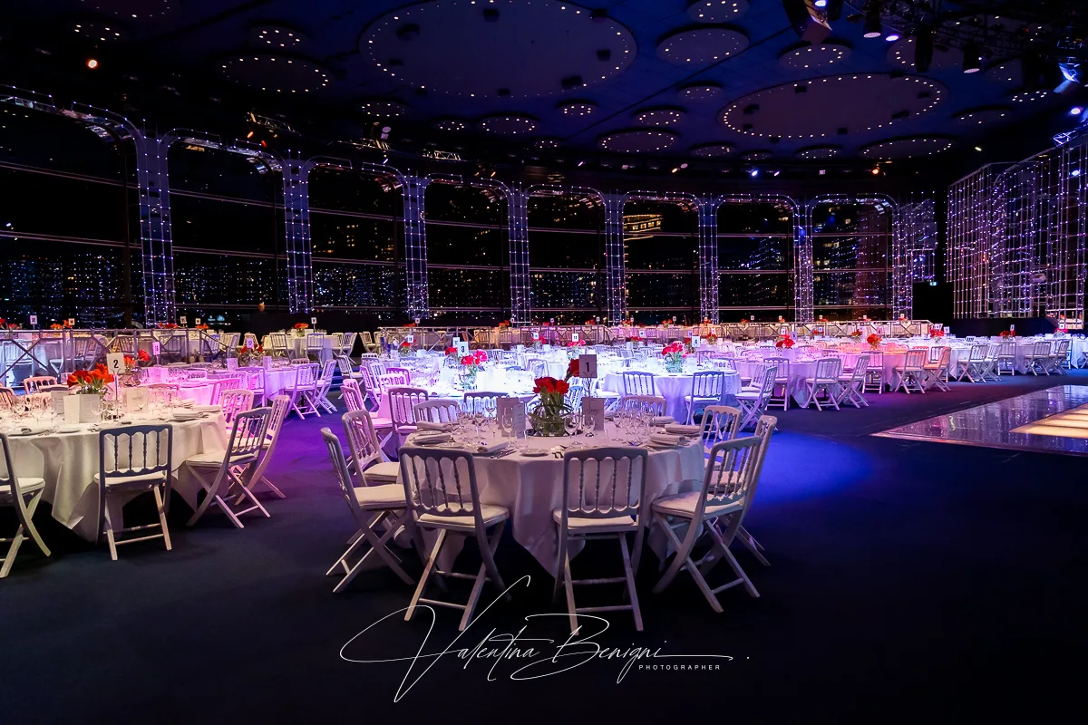 business event in a large room with tables and chairs